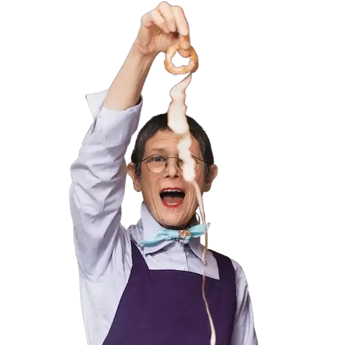 Image of Dorie Greenspan holding up an apple peel in a single piece